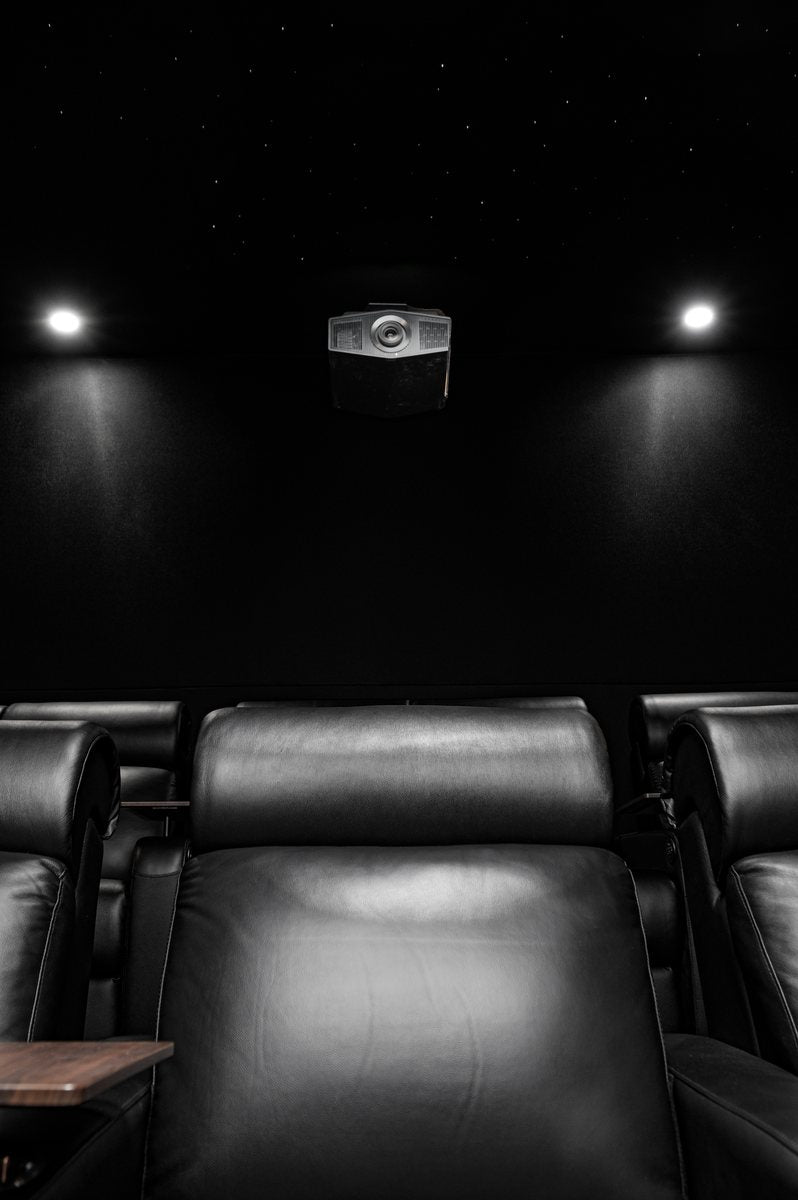 Ceiling-mounted projector in the dedicated cinema.